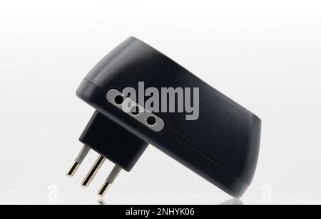 Black Power Adapter with USB Socket isolated on white background. Stock Photo