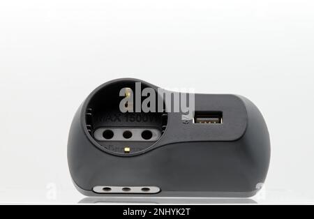 Black Power Adapter with USB Socket isolated on white background. Stock Photo