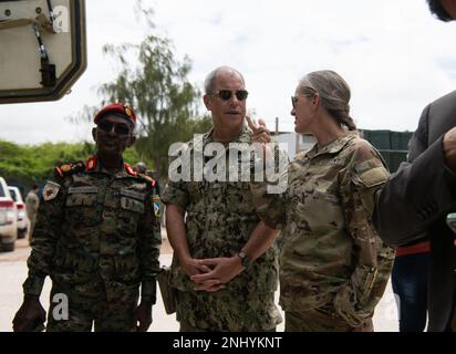 U.S. Army Maj. Gen. Jami Shawley, commanding general of the Combined Joint Task Force – Horn of Africa (CJTF-HOA); Brig. Gen. Tahir Ali Mohamed, headquarters chief of staff of Djibouti Armed Forces (FAD); and U.S. Navy Capt. Corey Johnston, Defense Attaché, United States Embassy to Djibouti, inspect one of the Armored Personnel Carrier’s (APC) at the African Union Transition Mission in Somalia (ATMIS) Headquarters in Somalia, Aug. 3, 2022. The U.S. donated 24 APC’s to ATMIS to aid in their fight against terrorism. Stock Photo