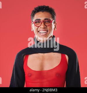 LGBTQ, queer and portrait of a gay man with unique fashion and style isolated against a studio red background. Transgender, homosexual and trendy Stock Photo