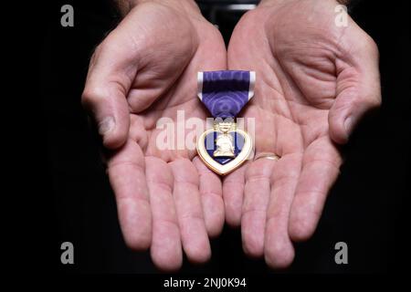 Retired Command Sgt. Maj. James K. Bodecker displays the Purple Heart he was awarded March 20, 2006, after being shot by a sniper in Ramadi, Iraq, February 17, 2006. Bodecker's unit, 1/506 Infantry, 4th Brigade, 101st Airborne Division (Air Assault) out of Fort Campbell, Kentucky, was deployed to Combat Outpost Corregidor, Ramadi, Iraq. Stock Photo