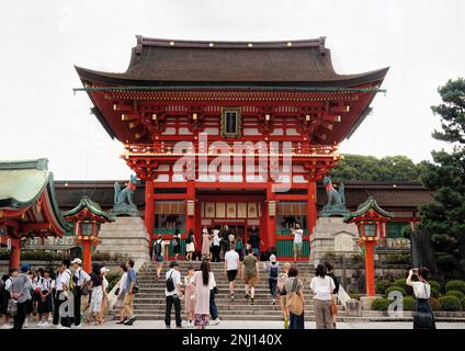 Kyoto, Japan - Sept, 2017: The Tori gates at Fushimi Inari Shrine with red wooden Asian architecture Stock Photo