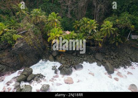Seascape with waves breaking on the rocks. Capurgana, Colombia. Stock Photo