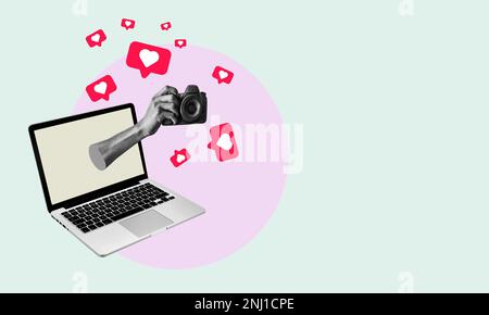 Art collage, hand out of laptop with camera on light background, multitasking at work. The concept of working with a laptop and photography. Stock Photo