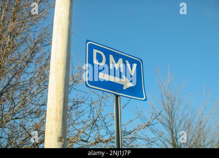 DMV sign street showing where to get drivers registration Stock Photo
