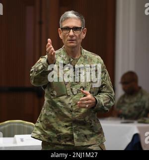 Maj. Gen. Joseph Heck, director of Defense Health Agency Region Indo-Pacific, speaks at the Regional Health Command-Pacific regional commander's conference, Aug. 4, 2022. Military treatment facility commanders and staff came from across the Pacific to attend the three-day conference at Joint Base Pearl Harbor-Hickam, Hawaii. Regional Health Command-Pacific, headquartered in Honolulu, is the most geographically dispersed command in Army Medicine, stretching more than 5,000 miles and five time zones across the Pacific. The command oversees Army medical units in the Pacific Northwest, Alaska, Haw Stock Photo