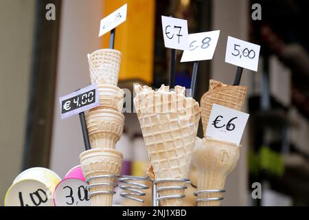 Several empty ice cream cones with different sizes and prizes Stock Photo