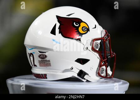 LOUISVILLE, KY - OCTOBER 22: A Louisville helmet sits on the sideline  during a college football game between the Pittsburgh Panthers and Louisville  Cardinals on October 22, 2022 at Cardinal Stadium in