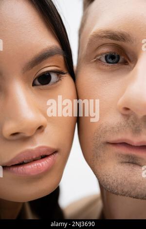 partial view of multiethnic romantic couple isolated on white,stock image Stock Photo