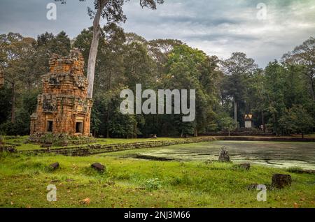 One of the 12 ruined 12th century Prasat Suor Prat towers next to a pond opposite the Elephant Terrace within Angkor Thom in Cambodia. Stock Photo