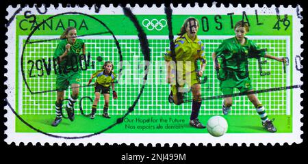 MOSCOW, RUSSIA - FEBRUARY 15, 2023: Postage stamp printed in Canada shows Football, Our Hope for the Future, Summer Olympic Games 2004 - Athens serie, Stock Photo