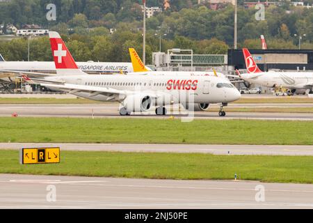 Zurich, Switzerland, September 27, 2022 Swiss International Airlines Airbus A220 aircraft is taxiing to its position Stock Photo