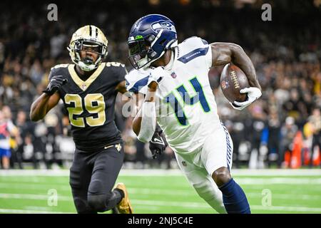 NEW ORLEANS, LA - OCTOBER 09: Seattle Seahawks wide receiver DK Metcalf  (14) heads for the endzone as New Orleans Saints cornerback Paulson Adebo  (29) defends during the football game between the