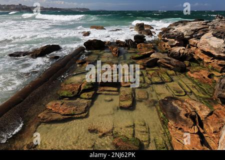 506 Strong waves break on the rocks next to Marine Parade in Manly suburb. Sydney-Australia. Stock Photo