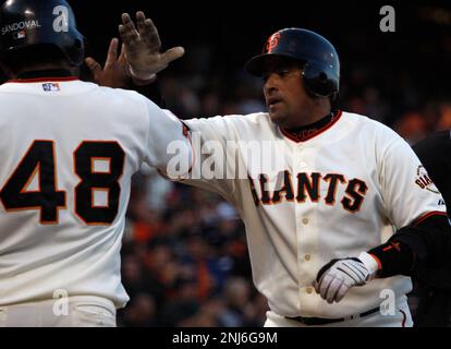 Giants catcher Bengie Molina and Pablo Sandoval (48) celebrate Molina's  2-run home run in the first inning vs. the Cincinnati Reds at AT&t Park in  San Francisco, Calif., on Friday, August 7