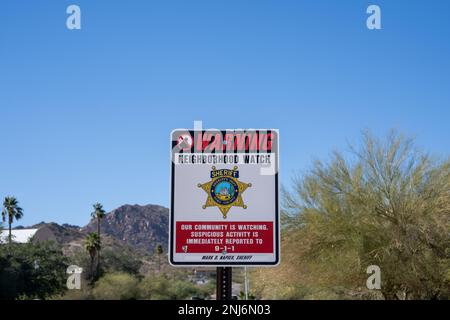 Ajo, AZ - Nov. 28, 2022: Neighborhood watch sign with Pima County Sheriff logo. Ajo crime rates are 24% lower than the national average according to 2 Stock Photo