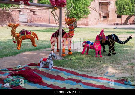 Hand made Rajasthani colourful dolls of Camel, horse and elephant displayed for sale at Mehrangarh Fort, Jodhpur, Rajasthan. Little dolls. Stock Photo