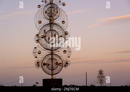 Wind sculpture on public roadway at sunset Cesar Manrique,Tahiche Lanzarote Canary Islands Spain Stock Photo