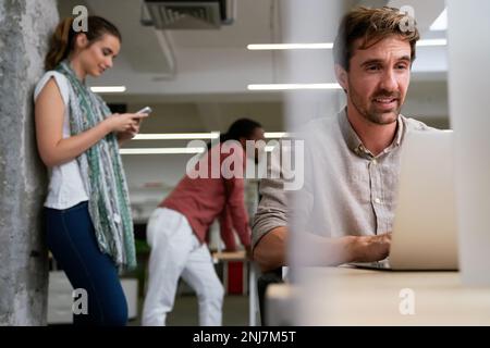 Programmers cooperating at IT company developing apps. People business work office concept Stock Photo