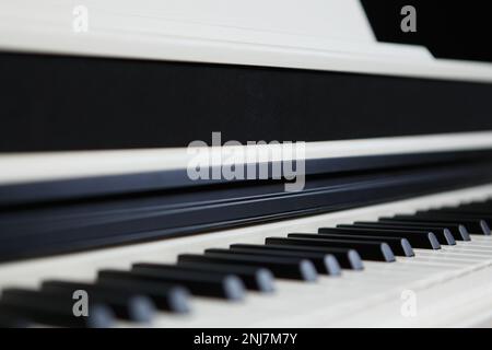 Modern white syntesizer piano. Professional high end musical instrument for pianist Stock Photo