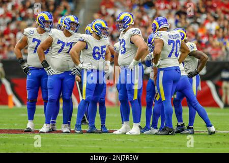 PHOENIX, AZ - SEPTEMBER 25: Arizona Cardinals offensive unit in a huddle  during the NFL game between the Los Angeles Rams and the Arizona Cardinals  on September 25, 2022, at State Farm