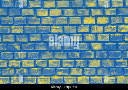 brick wall colored in colors of Ukrainian flag background Stock Photo