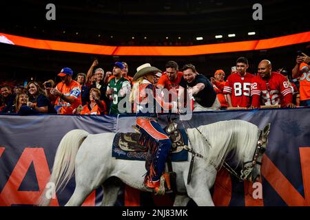 Rider Ann Judge guides Thunder during a ceremonial run after the Denver  Broncos scored in the first half of an NFL preseason football game  Saturday, Aug. 26, 2023, in Denver. (AP Photo/David