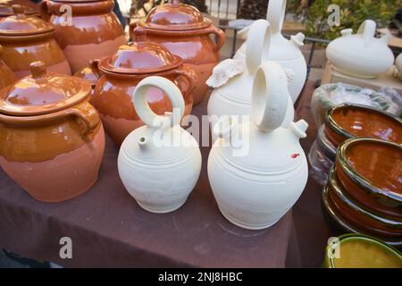 Detail of some jugs and ceramic and clay jugs in a stall of a traditional open-air marke Stock Photo