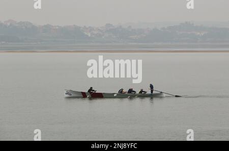 A traditional Cantabrian trainera racing rowing boat training in the bay of Santander Cantabria Spain Stock Photo