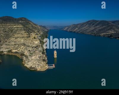 Aerial view of the bell tower of San Juan Evangelista church in the old town of Fayón. Since 1967 it has been submerged by the Ribarroja reservoir Stock Photo