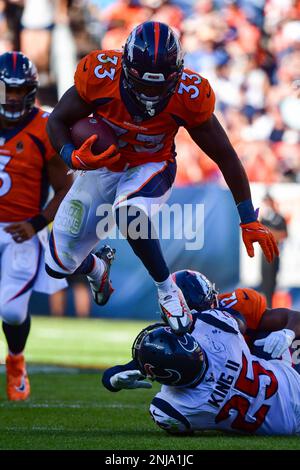 September 18, 2022: Denver Broncos running back Javonte Williams (33)  hurdles Houston Texans cornerback Desmond King II (25) in the football game  between the Denver Broncos and Houston Texans at Empower Field Field in  Denver, CO. Denver hung