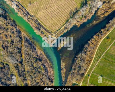 Confluence of the Segre and Cinca rivers, where you can see the different contribution of sediments from each river (Segrià, Lleida, Catalonia, Spain) Stock Photo