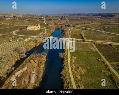 Confluence of the Segre and Cinca rivers, where you can see the different contribution of sediments from each river (Segrià, Lleida, Catalonia, Spain) Stock Photo