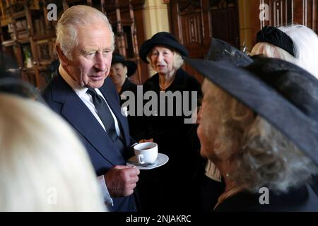 Britain's King Charles III speaks to the wives of victims of the Aberfan disaster during a reception for local charities at Cardiff Castle in Wales, Friday Sept. 16, 2022. King Charles III and Camilla, the Queen Consort, arrived in Wales for an official visit. The royal couple previously visited to Scotland and Northern Ireland, the other nations making up the United Kingdom, following the death of Queen Elizabeth II at age 96 on Thursday, Sept. 8. (Chris Jackson/Pool via AP)