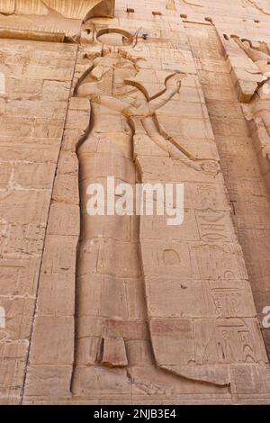 Ancient egyptian goddess Isis carved at Philae temple on Agilika Island in Aswan, Egypt Stock Photo