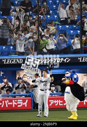 Munetaka Murakami of the Yakult Swallows celebrates with teammates after  scoring on a sacrifice fly by Shingo Kawabata in the eighth inning of an  interleague baseball game against the Orix Buffaloes on