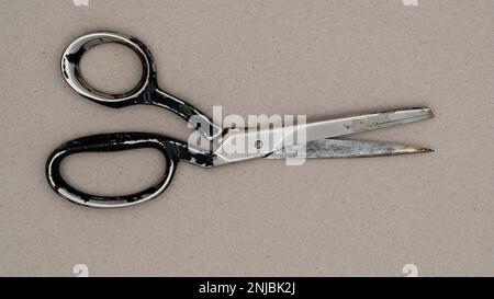 Used old scissors. Top of view of an old scissor. Stock Photo