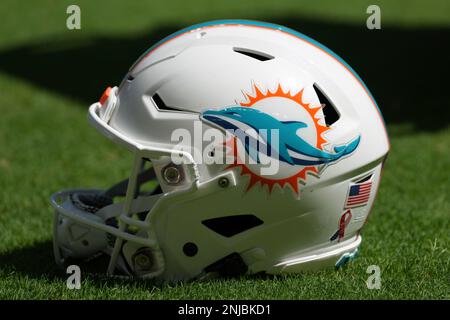 A Miami Dolphins helmet rests on the field during an NFL football