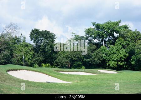 A swing across the greens with bunkers at a golf club in Mexico Stock Photo