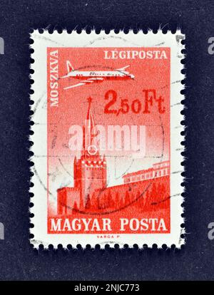 Cancelled postage stamp printed by Hungary, that shows Ilyushin II-18 Plane over Moscow, circa 1966. Stock Photo