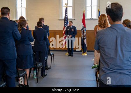 Lt. Col. William Skaggs, director of operations for the 157th Air Intelligence Squadron, receives a standing ovation from the audience, during his retirement ceremony, Aug. 6, 2022, at Jefferson Barracks Air National Guard Base, St. Louis, Missouri. Skaggs served for 37 years. Stock Photo