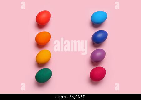 Frame made of colorful Easter eggs on pink background Stock Photo