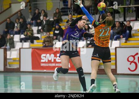 Gijon, Spain, 22nd February, 2023: Motive.co Gijon's player Mina Novovic (23) shoots on goal against the opposition of June Loidi (22) during the 16th Matchday of the Iberdrola League 2022-23 between Motive.co Gijon and Super Amara Bera Bera with a 23-35 defeat of the locals on February 22, 2023, at the La Arena Sports Pavilion in Gijon, Spain. Credit: Alberto Brevers / Alamy Live News Stock Photo