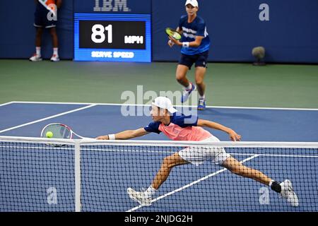 Cooper Woestendick and Mitchell Lee during a junior boys' doubles match ...