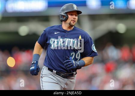 CLEVELAND, OH - SEPTEMBER 02: Seattle Mariners center fielder Julio  Rodriguez (44) puts the home run helmet on Seattle Mariners catcher Cal  Raleigh (29) after Raliegh hit his second home run of