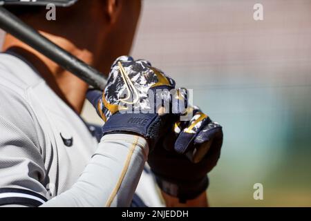 The batting gloves worn by New York Mets' Pete Alonso are seen as he waits  on deck to bat during the second inning of a baseball game against the  Cincinnati Reds in