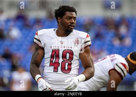 LANDOVER, MD - September 11: Washington Commanders linebacker Cole Holcomb ( 55) congratulates wide