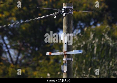 Overhead Fiber Data Cable Post With Metal Bracket Stock Photo