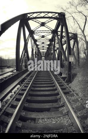 Abandoned rusted vintage railroad bridge Stock Photo