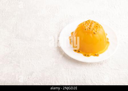 Mango and passion fruit jelly  on gray concrete background. side view, copy space. Stock Photo